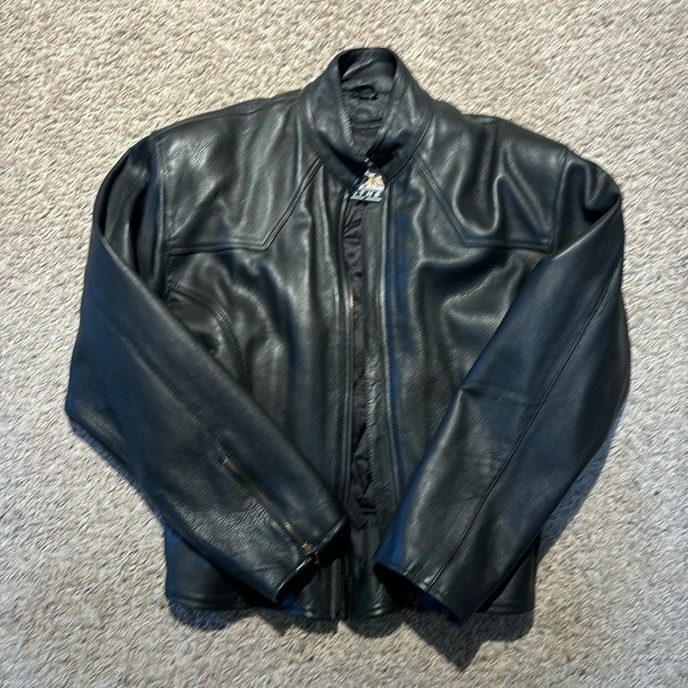 Heavy black leather motorcycle jacket.